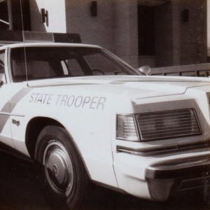 "State Trooper" patrol car with lights in its roof