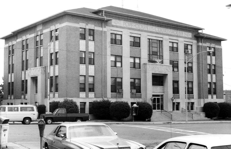 Multiple-story courthouse building as seen from streetcorner