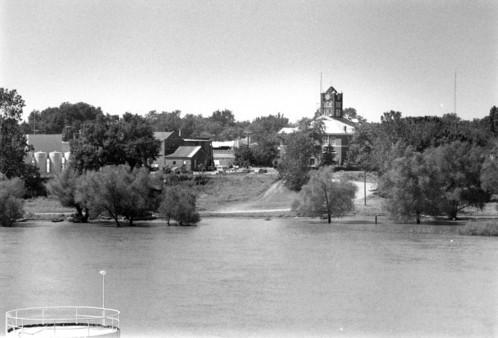 River with town and brick courthouse in the background