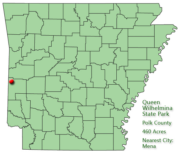 Arkansas map with red dot in Polk County and explanation in green text