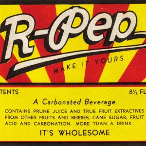 Yellow red and white label for R-Pep carbonated beverage saying "contains prune juice and true fruit extractives from other fruits and berries cane sugar fruit acid and carbonation"