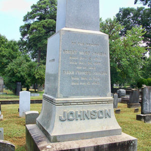 "Johnson" monument and gravestones in cemetery