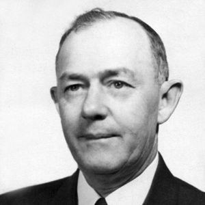 Older white man in suit and tie