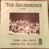 Group photograph of white musicians with their instruments on signed cover of "The Rackensack Volume 1" album
