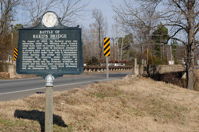 "Battle of Reed's Bridge" sign with highway bridge