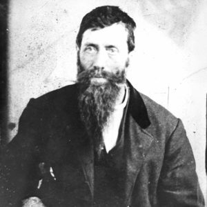 White man with heavy beard and mustache