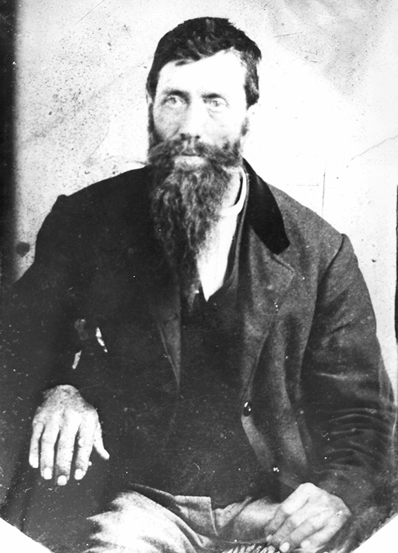 White man with heavy beard and mustache