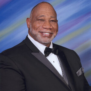 Older African-American man smiling in tuxedo