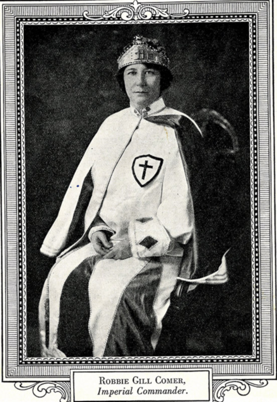 White woman with crown sitting in her robes in frame labeled "Robbie Gill Comer Imperial Commander"