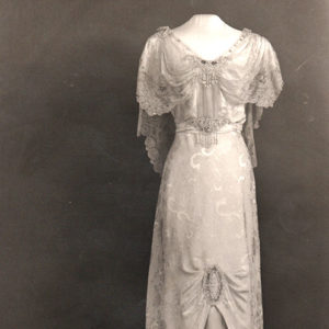 White lace dress on headless display mannequin