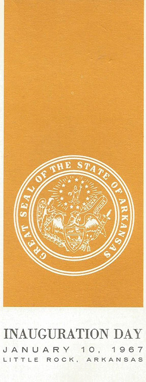 Seal in white on gold background with text on program cover