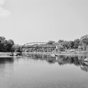 River with steel arch bridge in the background