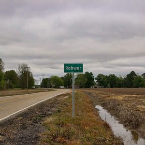 "Rohwer" road sign on two-lane highway