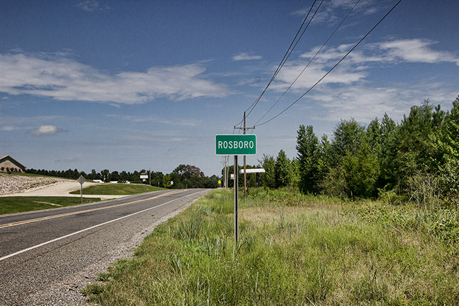 "Rosboro" road sign on two-lane highway
