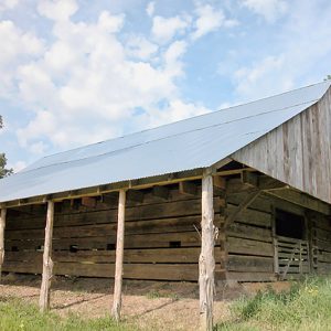Wood barn with metal roof and gate