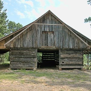 Front view of wood barn with metal roof