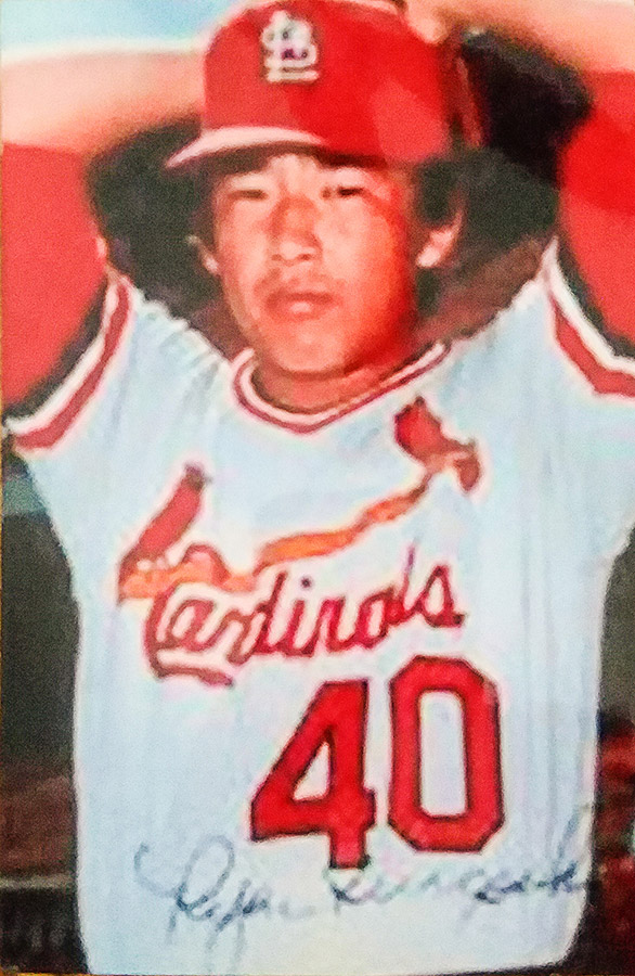 Japanese-American man in red and white uniform