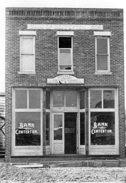 Two-story bank building with "Bank of Centerton" on the windows