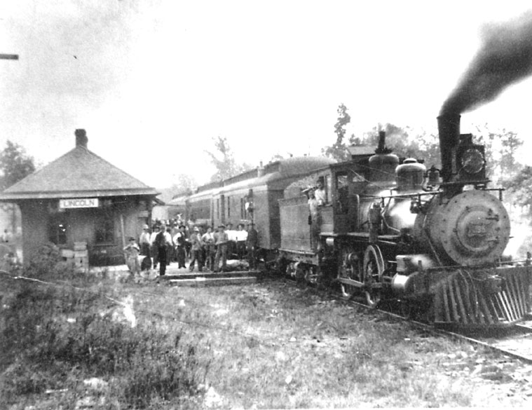 People boarding a steam locomotive at train station