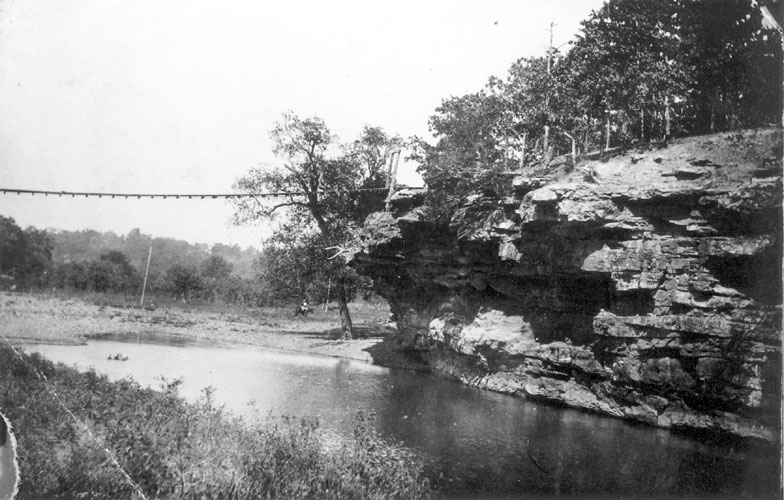 Suspension bridge over a river between two cliffs