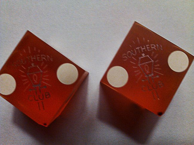 Pair of red dice stamped with Southern Club logo