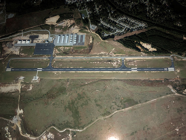 View of airport runway and buildings from above