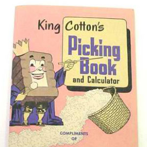 Cartoon of cotton bale with face dressed like a king and basket of cotton on pink book cover
