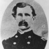 White man with mustache in military uniform