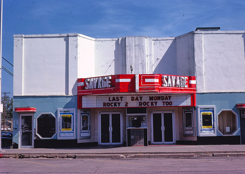 "Savage" theater building with marquee on street