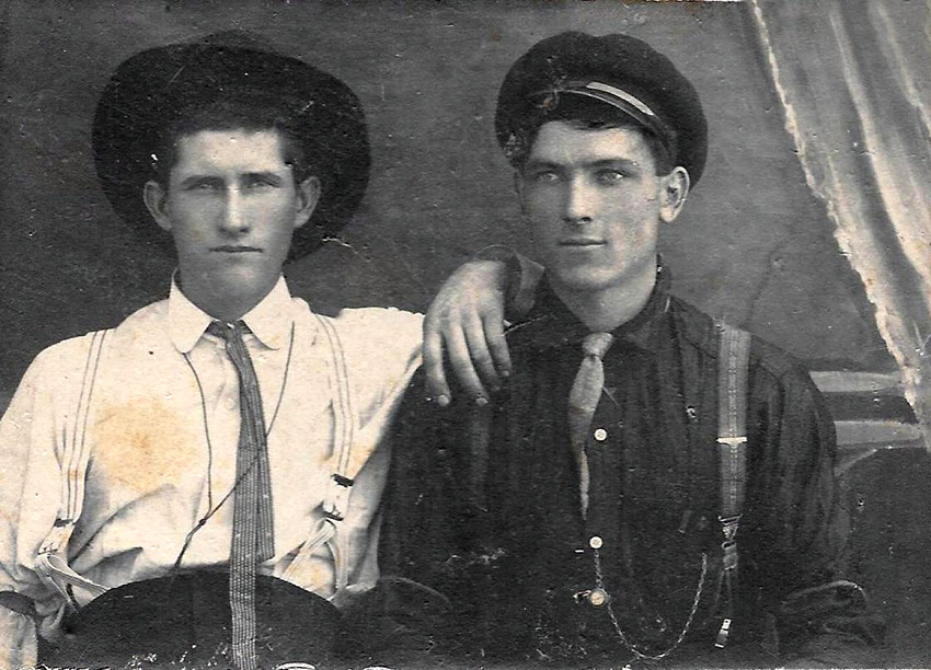 Two young white men in hats and ties