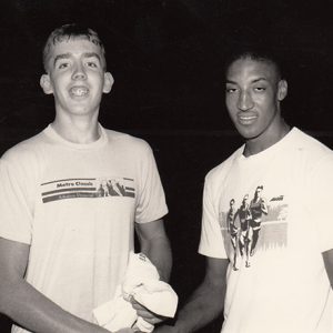 Young white man and young African-American man smiling in T-shirts