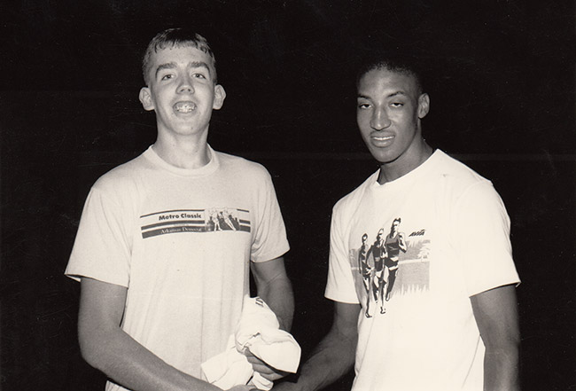 Young white man and young African-American man smiling in T-shirts