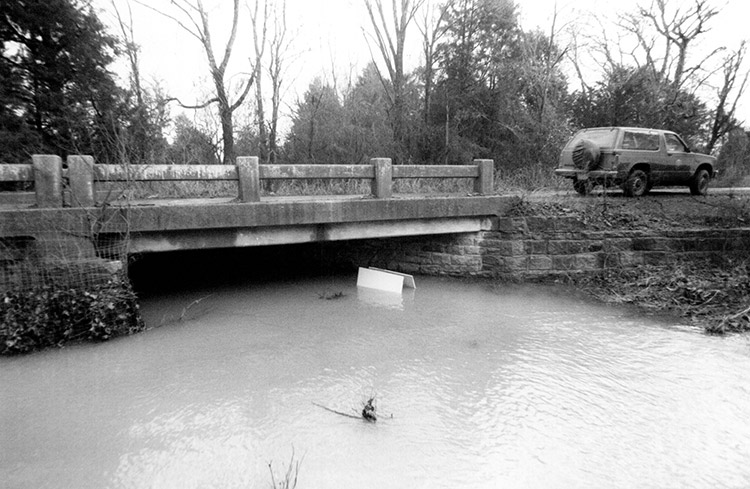 Concrete bridge over flooded creek