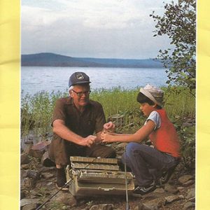 Older white man with boy at campsite with lake on yellow program with black text