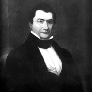 White man with dark hair in suit and white shirt