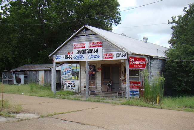 Single-story "Shadden's" barbeque building with beer signs