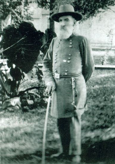 Old white man with long beard, hat and sword in Confederate uniform
