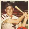 White man with baseball bat in uniform and cap on card with white and black text on blue border and round portrait in lower right corner