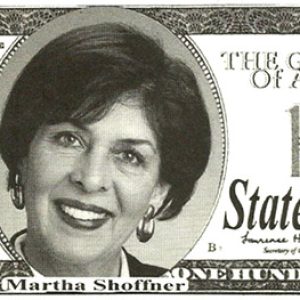 Fake 100 dollar bill with portrait of white woman smiling and "Martha Shoffner State Treasurer" written on it
