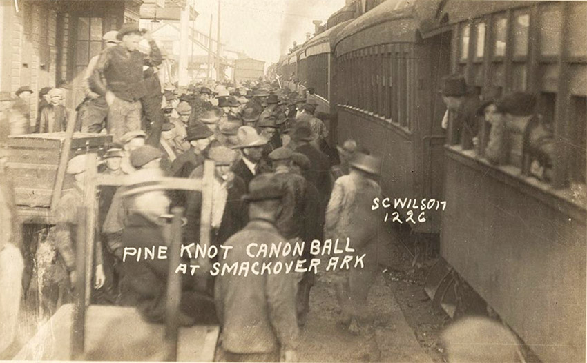 Crowd of people standing next to train