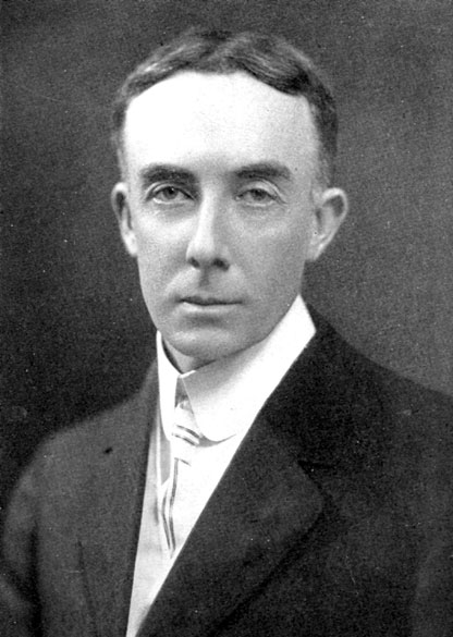 White man with short hair in suit and tie