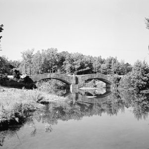 Concrete arch bridge over river