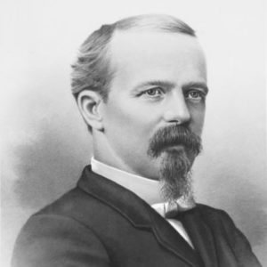 Old white man with beard and mustache in suit and tie