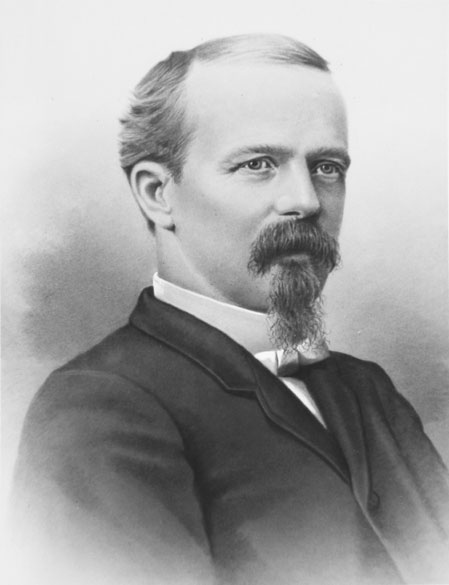 Old white man with beard and mustache in suit and tie