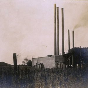 Industrial buildings with tall smokestacks