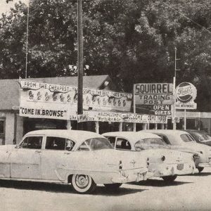 Cars parked in front of "Squirrel Trading Post"