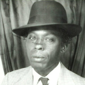 Young African-American man wearing a fedora hat and suit