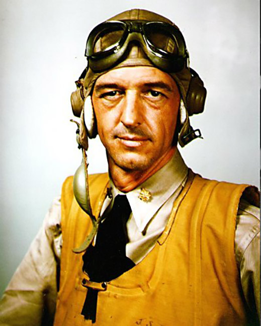 White man in aviator uniform with hat and goggles