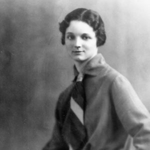 Young white woman in shirt and striped tie