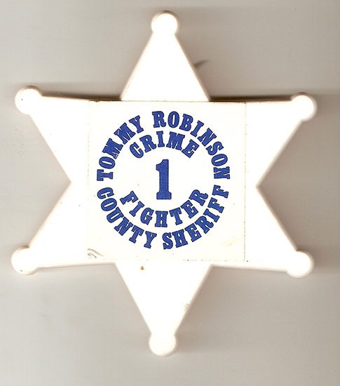 White star badge pin with blue text saying "Tommy Robinson county sheriff number one crime fighter"